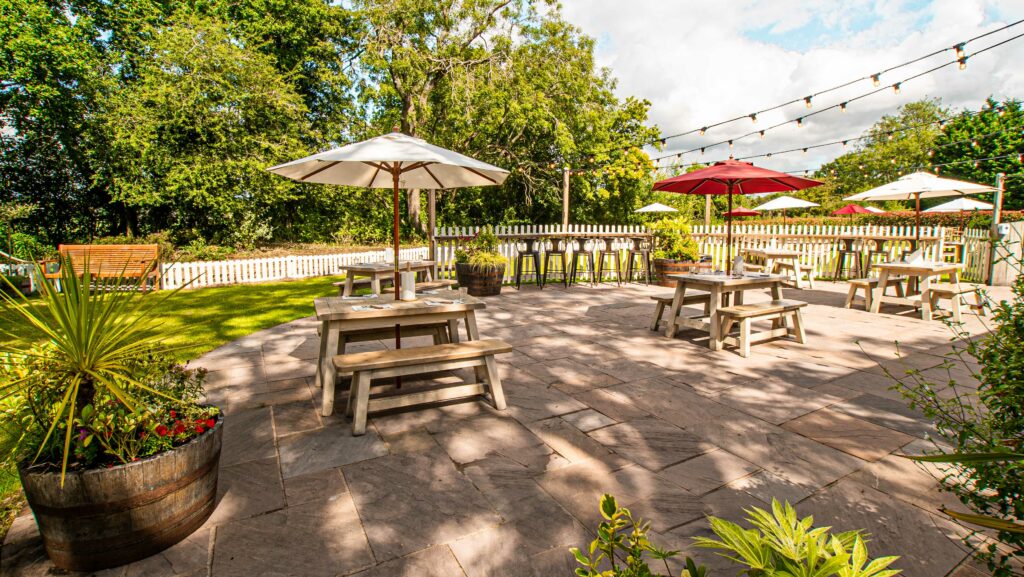 Hickory's Smokehouse Burton green outdoor dining garden area, green space outdoor benches
