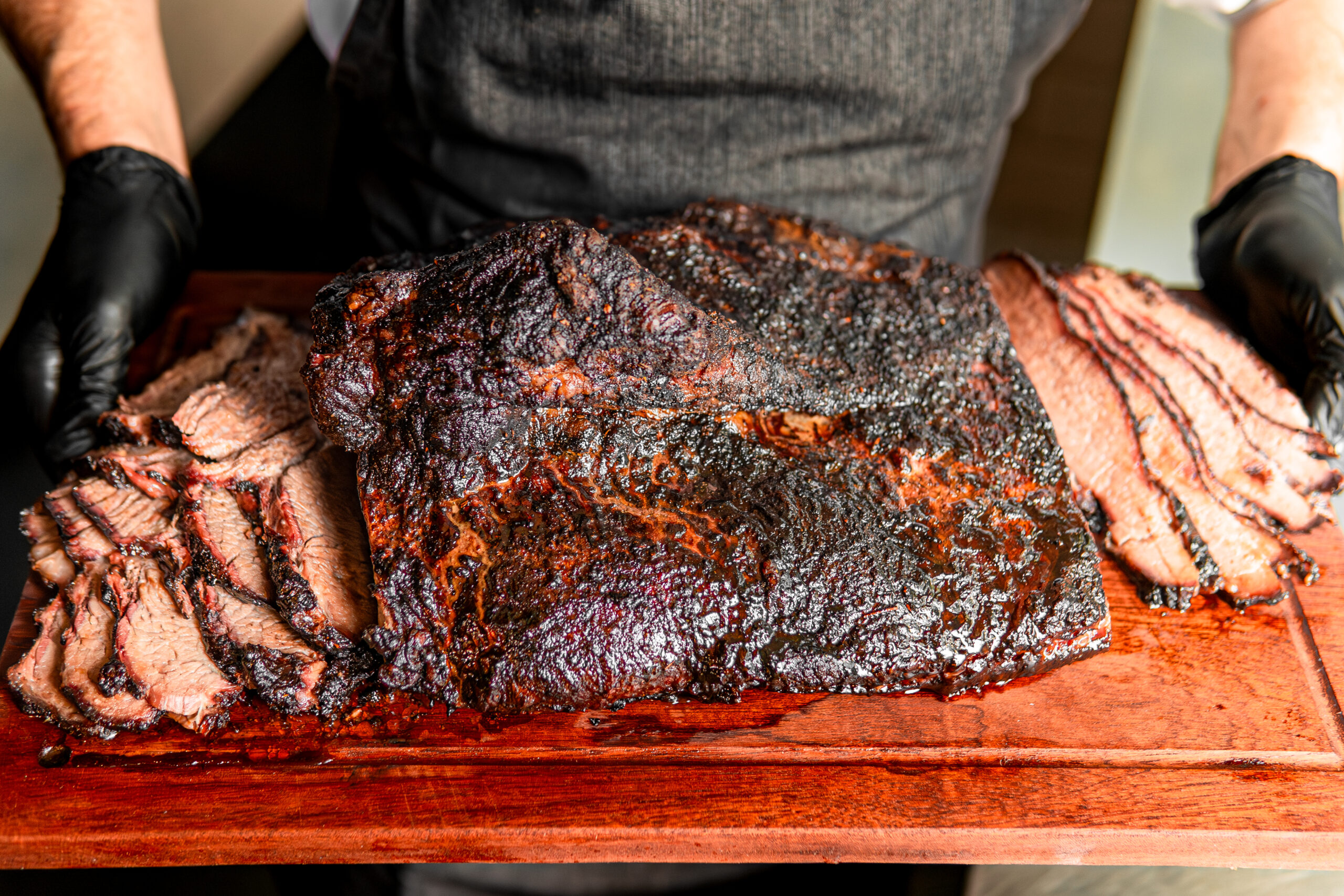 16 hour smoked Texas Style Brisket at Hickory's Smokehouse for National BBQ Month 2025