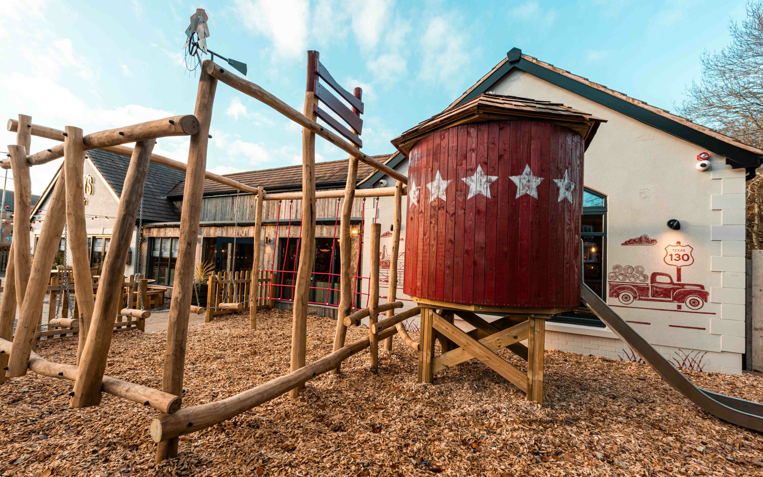 outdoor wooden fun kids play area outside authentic American BBQ smokehouse